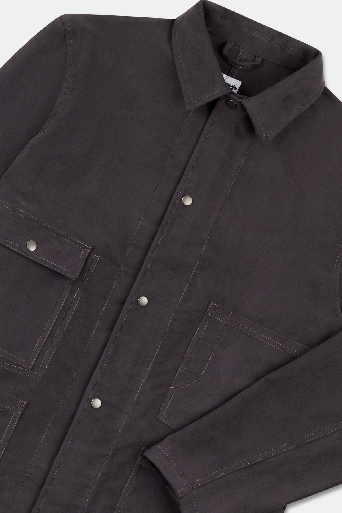 Close up flatlay of mens carter moleskin chore jacket in slate.