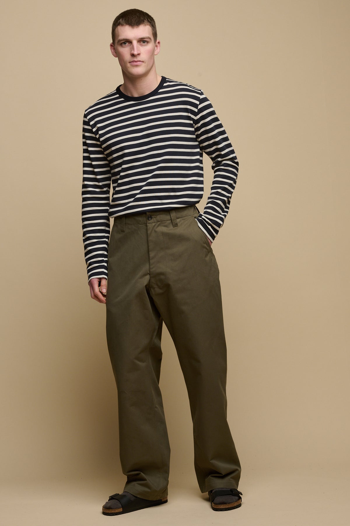 
            Full body image of male wearing field trousers in olive paired Breton in navy ecru