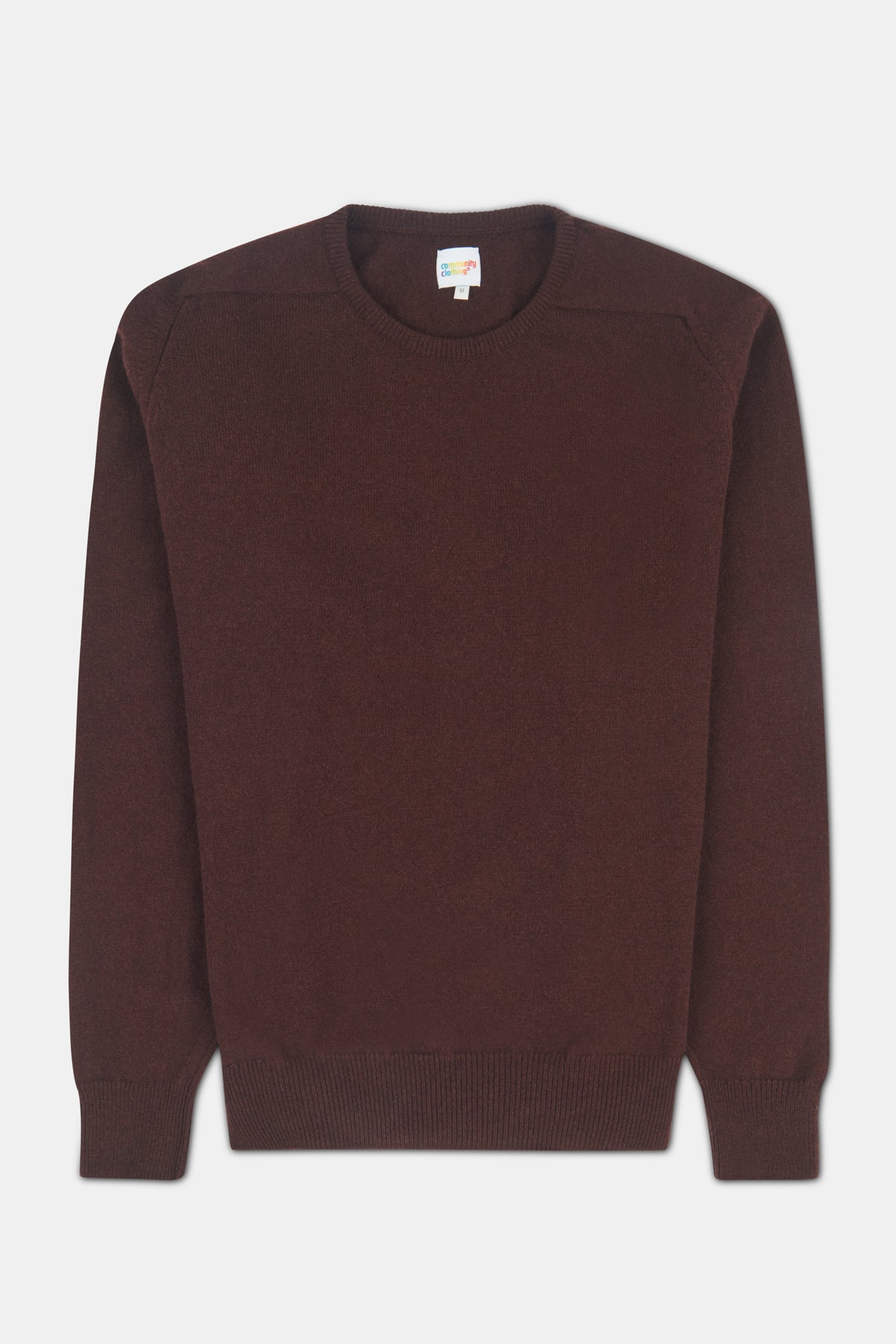 Brown sweater on a light gray background