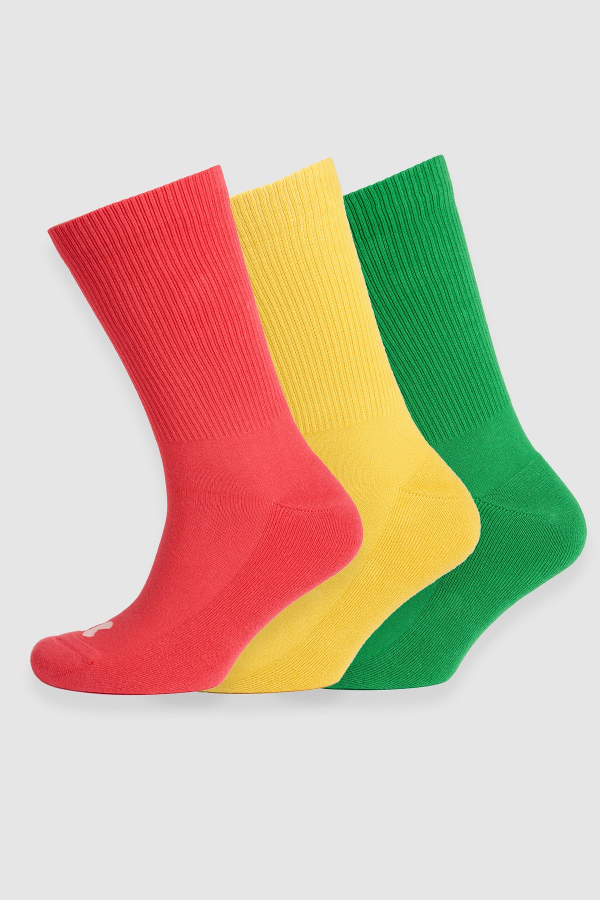 
            Pack of three calf length sports socks in pink, canary yellow and apple green.