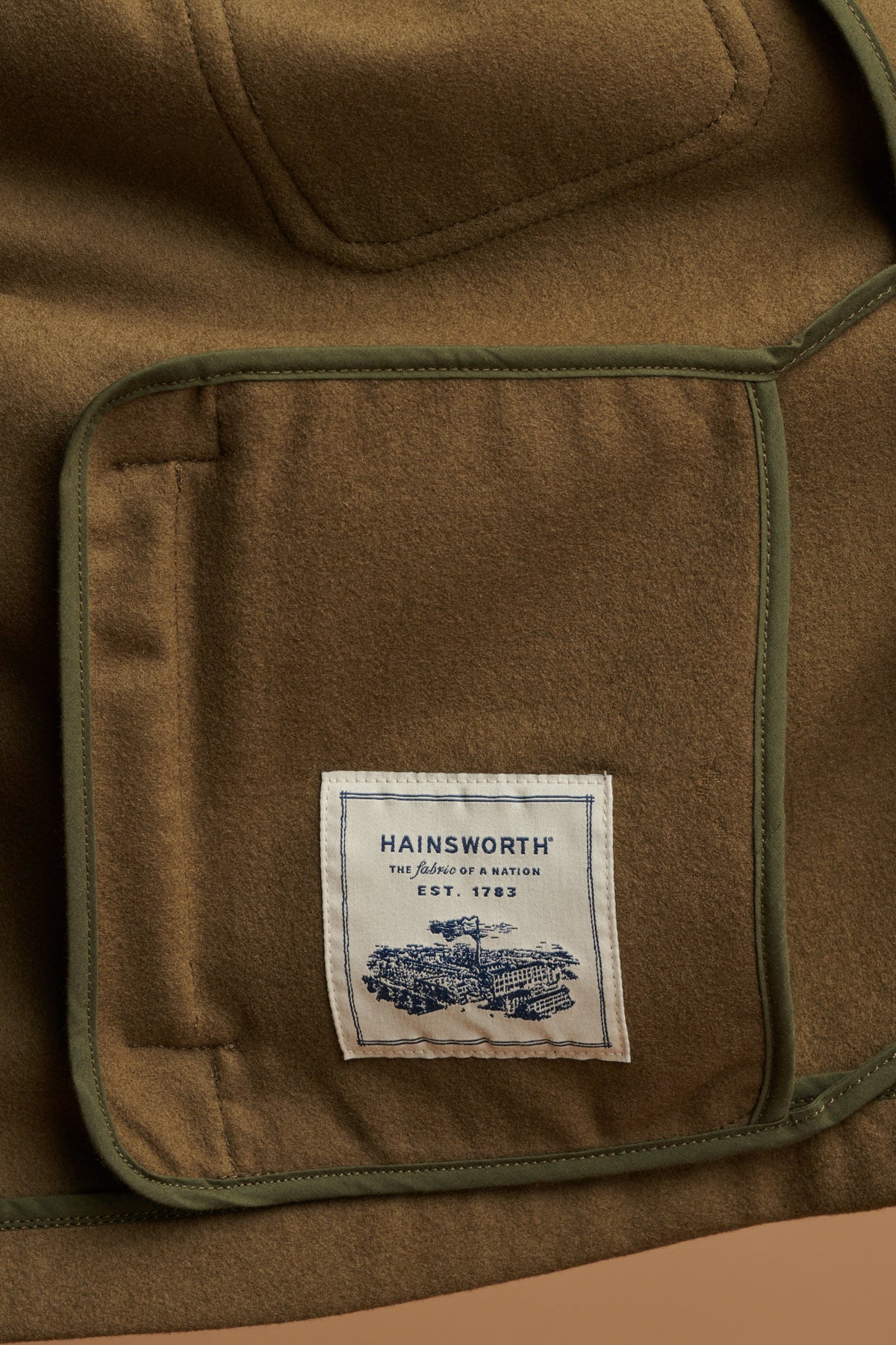The Arthur wool chore jacket is made from fabric from Hainsworth, made in Yorkshire. Hainsworth label sewn on the inside