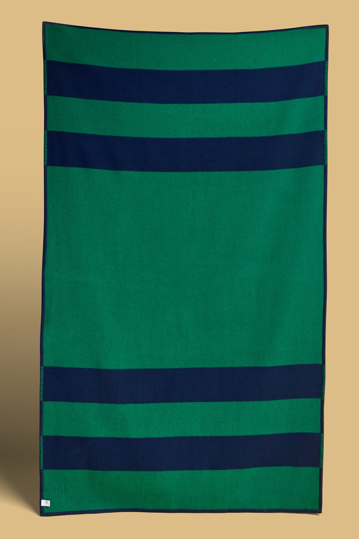 
            The back of the bottle and navy stripe blanket, the reverse has the opposite colours. 