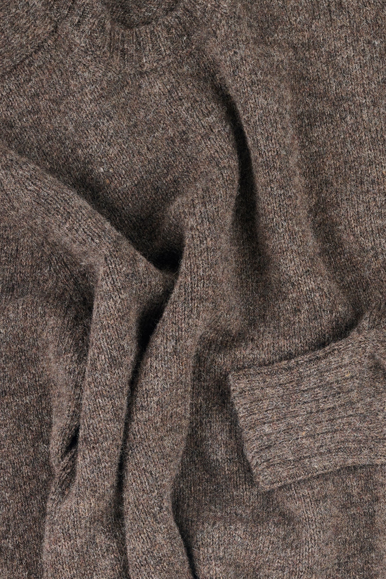 Close-up of a brown knit jumper