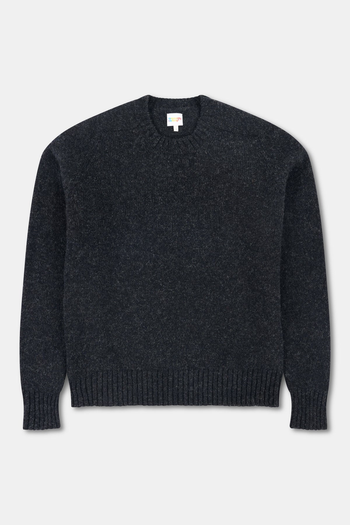Charcoal marl shetland jumper on white background