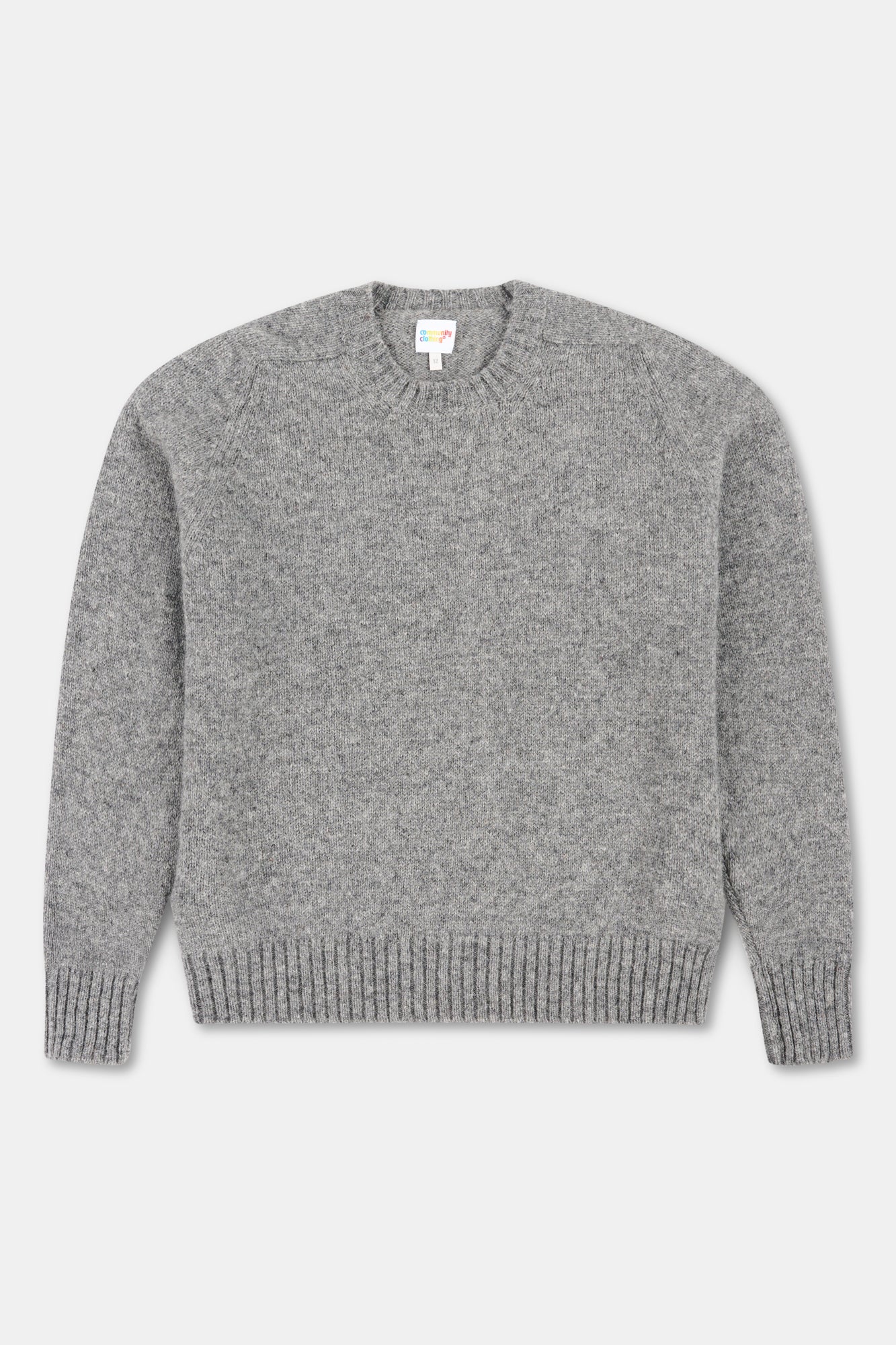 Grey marl knit jumper on white background.