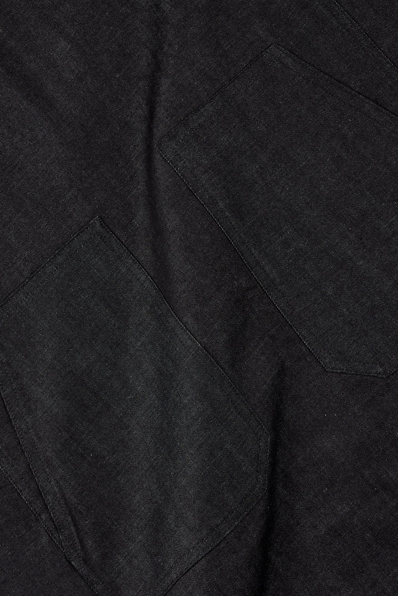 Close-up of lightweight indigo fabric with pockets.
