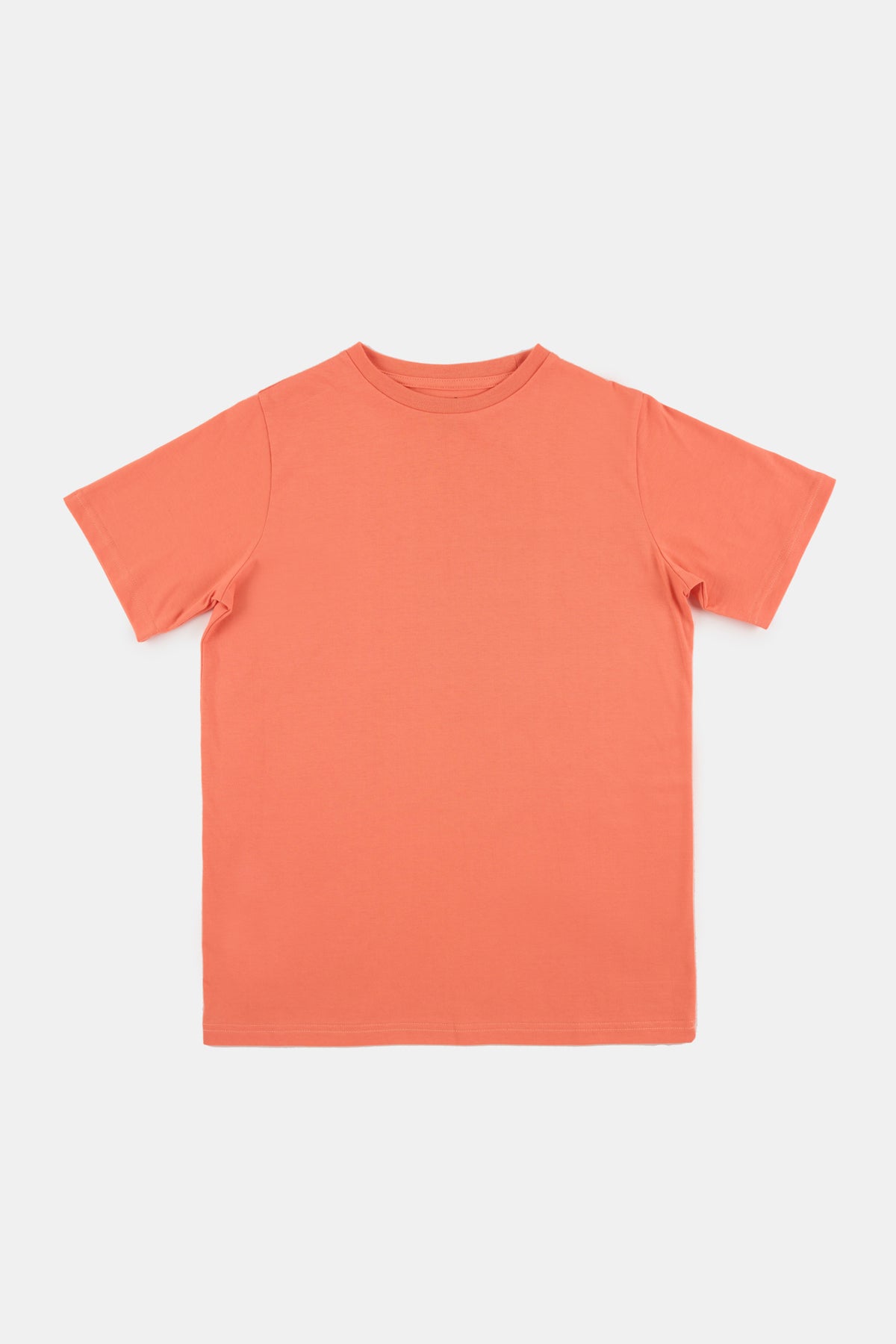 Flatlay product shot of short sleeve t shirt in peach