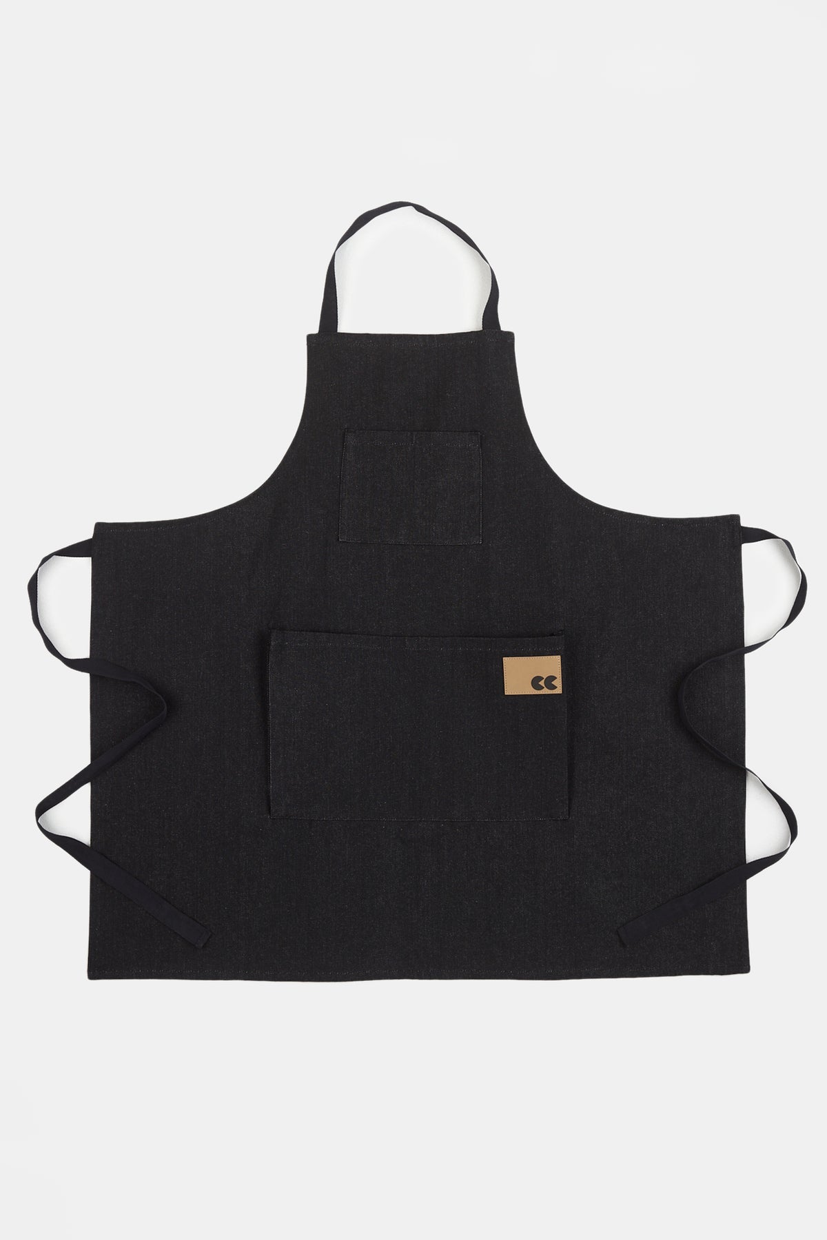 
            Unisex black denim apron flatlay