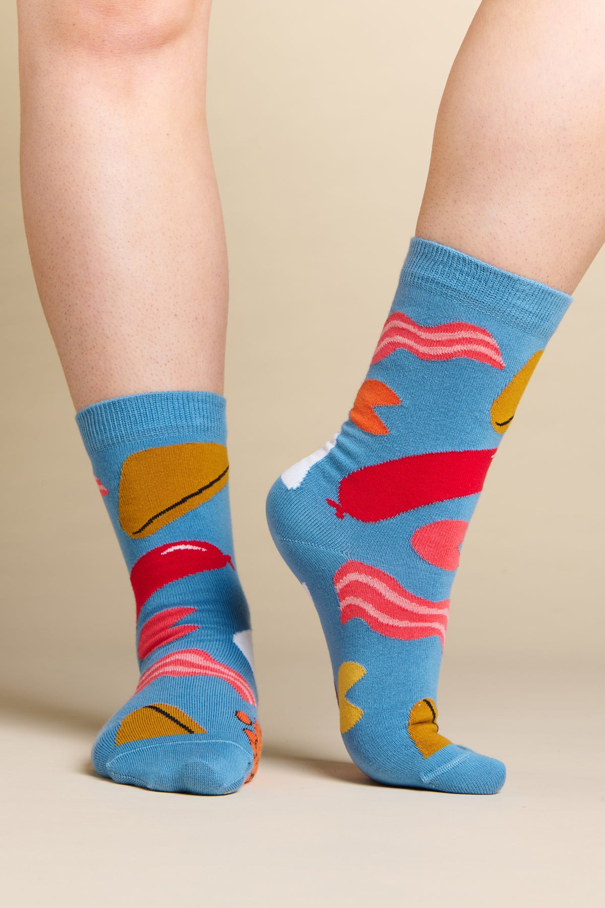 Model wearing blue full english design sock