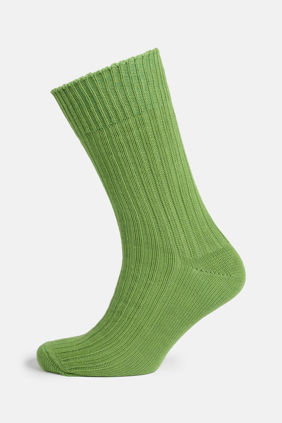 Ghost mannequin shot of a community clothing premium ribbed cotton sock in an Apple Green colour.