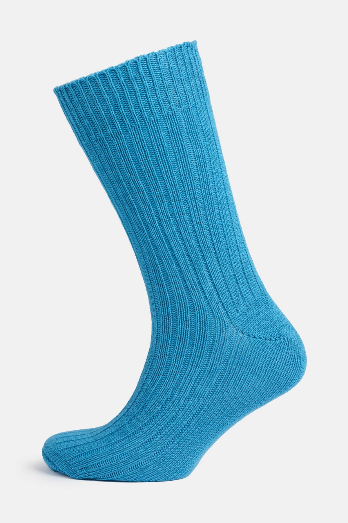 Ghost mannequin shot of a community clothing premium ribbed cotton sock in Bright Blue