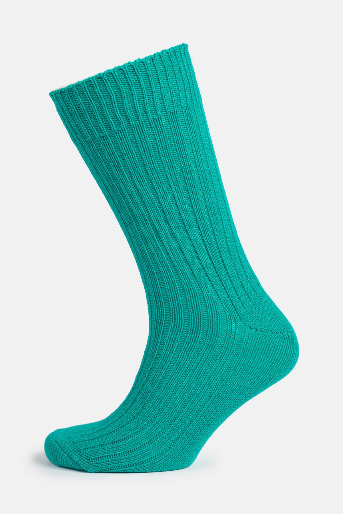 Ghost mannequin shot of a community clothing premium ribbed cotton sock in Emerald Green