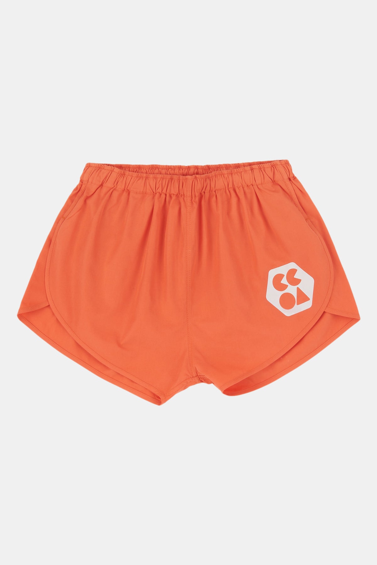 Flatlay product shot of lightweight running short plastic free in flame red. with CCOA logo