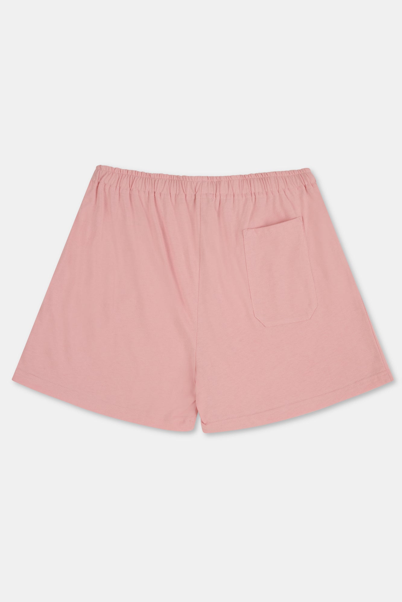 A pair of pale pink jersey shorts with an elastic waistband and pocket, shown flat against a plain white background.