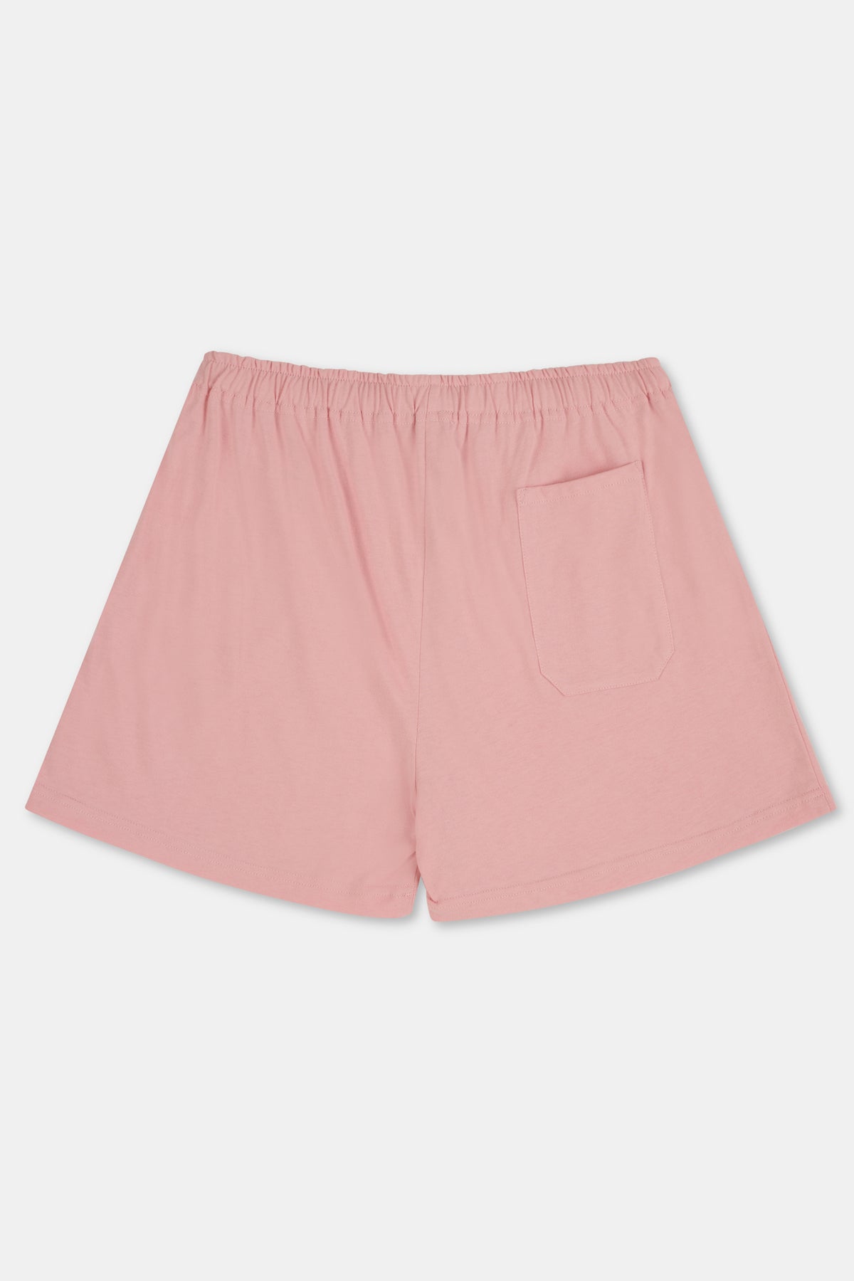 A pair of pale pink jersey shorts with an elastic waistband and pocket, shown flat against a plain white background.