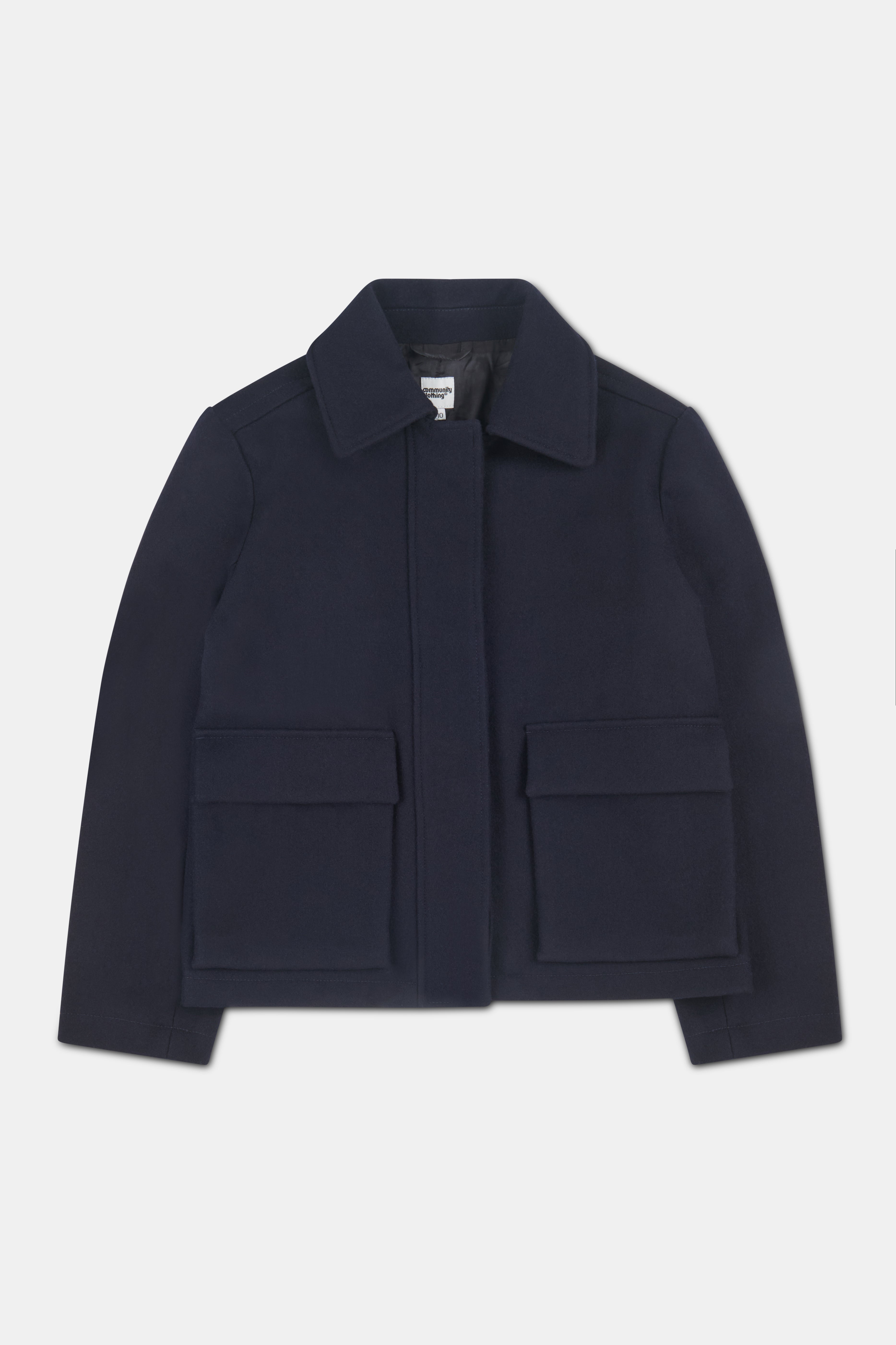 Women's navy short wool coat with two front patch pockets with flaps.
