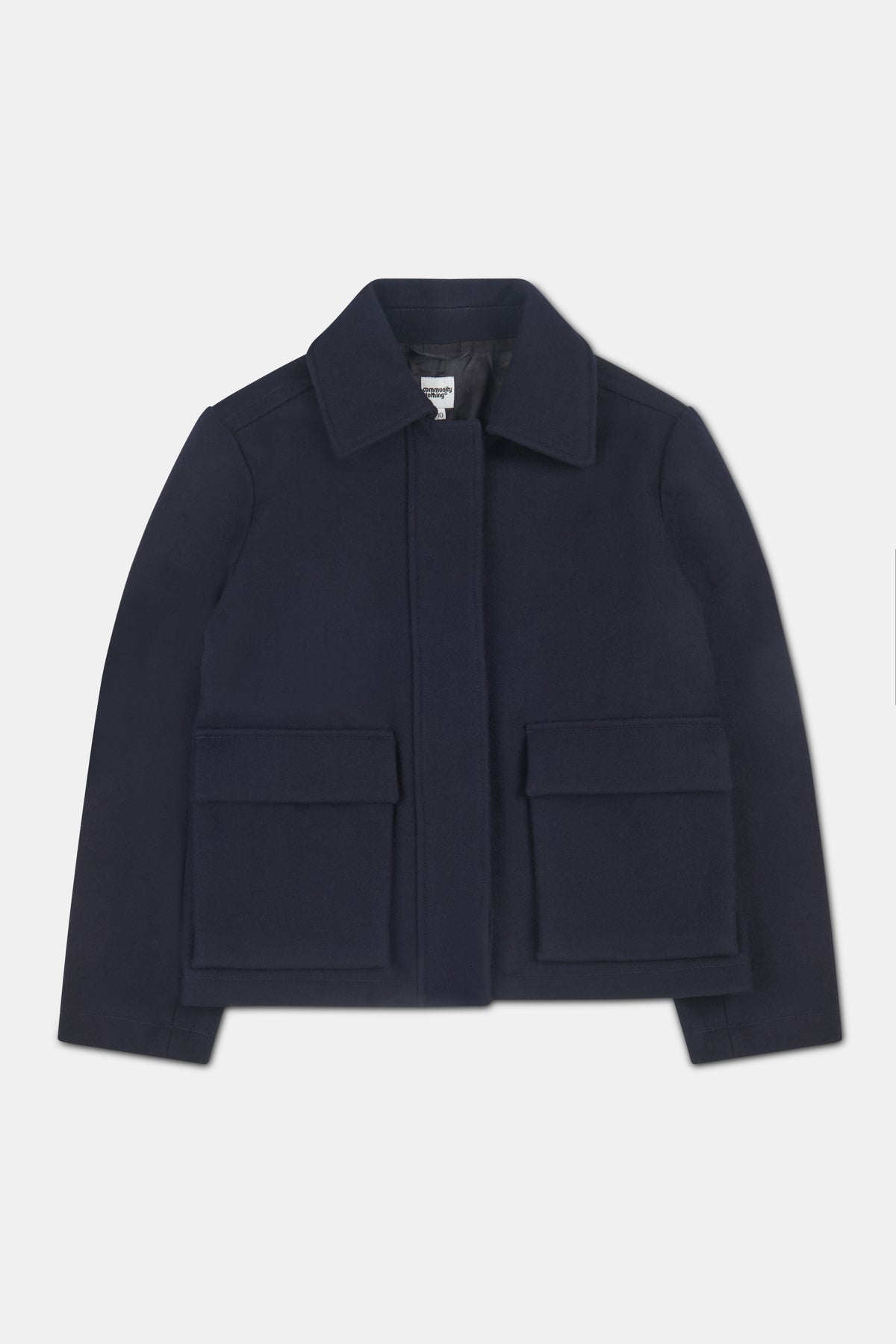 Women's navy short wool coat with two front patch pockets with flaps.