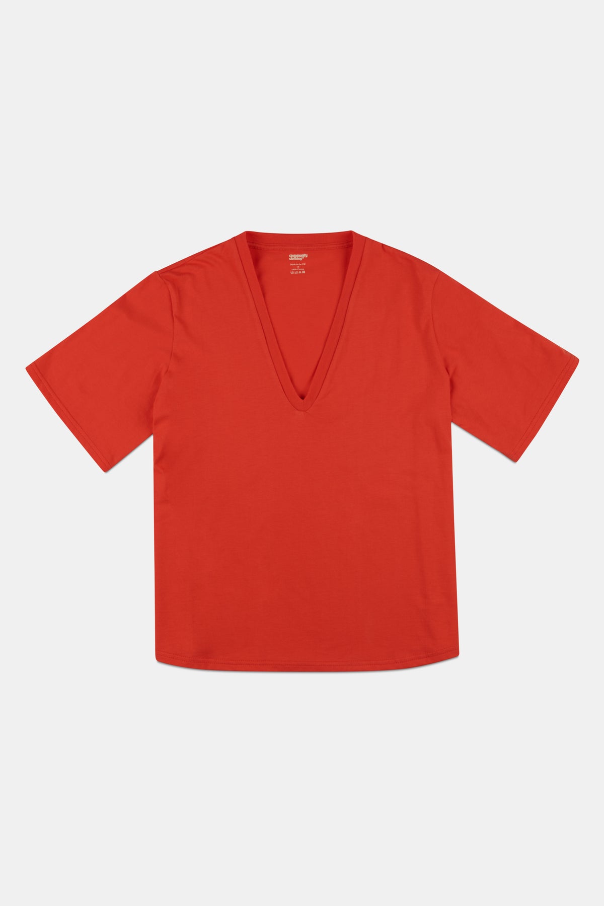 Flatlay of women's short sleeve v neck t shirt in flame red.