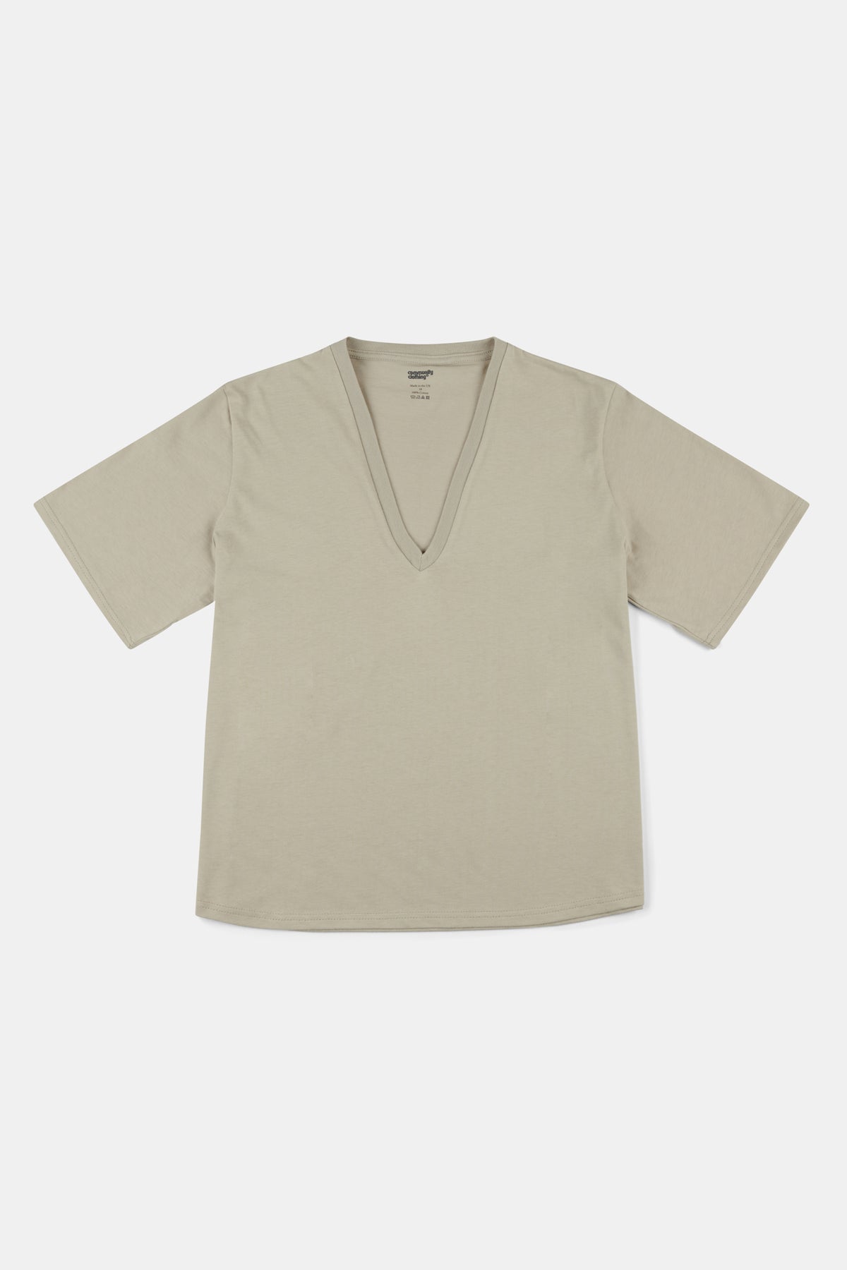 Flatlay of women's short sleeve v neck t shirt in stone with curved hem