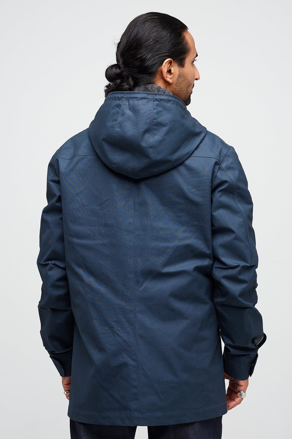 Back of male wearing mountain parka in navy